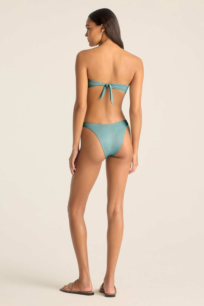 Woman turned away wearing a metallic aqua bandeau swim top with matching swim bottoms 
