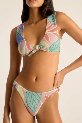 Woman wearing a jungle printed bikini top with matching swim bottoms