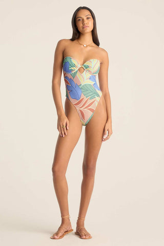 Woman wearing a bandeau one-piece jungle printed swimsuit